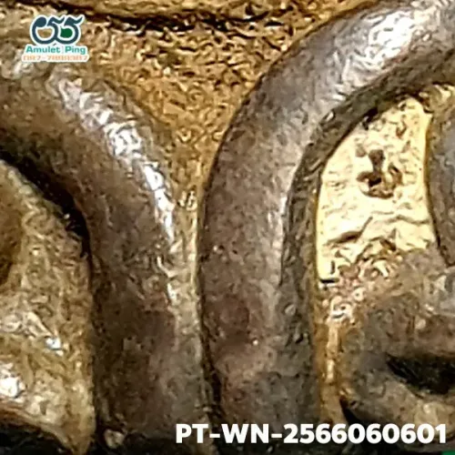 100× magnification — Luang Pu Iam statuette, Yant Yung, Na on the knee, Mixed