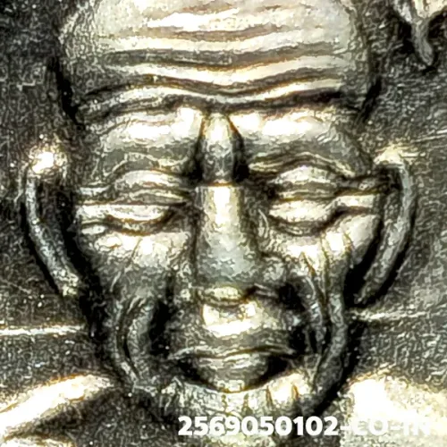 100× magnification — Luang Phor Thuad coin, Pha Pak (split mouth), Silver, Wat