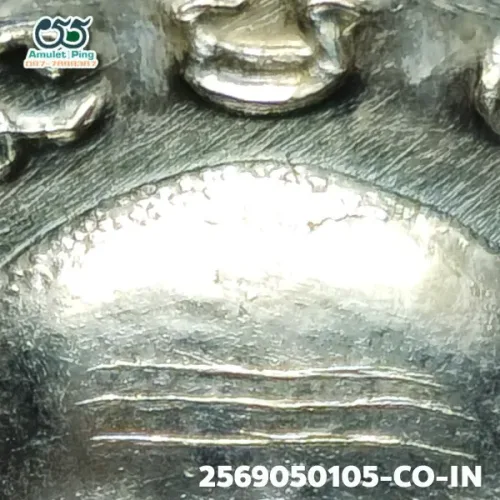 100× magnification — Luang Phor Thuad coin, Pha Pak (split mouth), Silver, Wat
