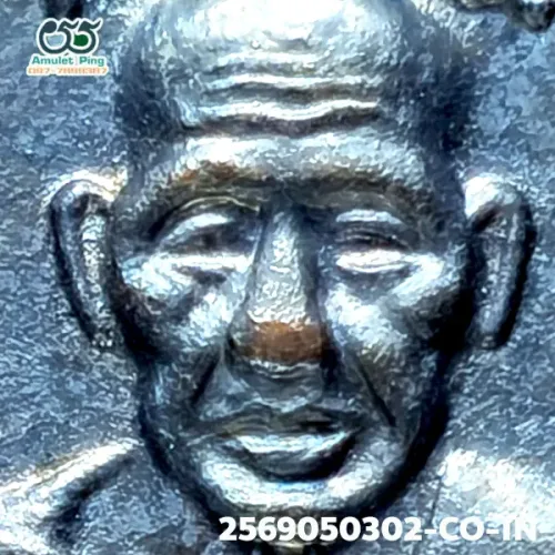 100× magnification — Luang Phor Thuad coin, small fish-roe dots, Blackened