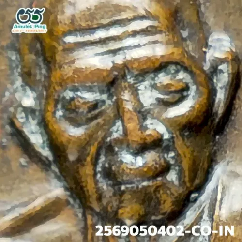 100× magnification — Luang Pu Tim amulet, Phim Sema, 8th cycle (age 96), Copper