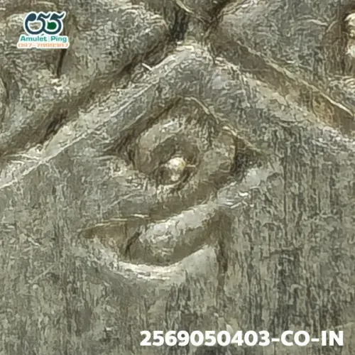 100× magnification — Luang Pu Tim amulet, Phim Sema, 8th cycle (age 96), Silver