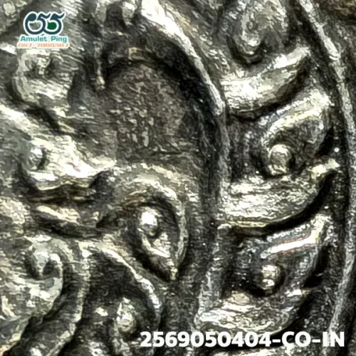 100× magnification — Luang Pu Tim amulet, Phim Sema, 8th cycle (age 96), Silver