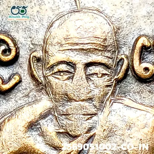 100× magnification — Luang Phor Klan coin, Phim Sian Tong back, Copper, Wat Phra