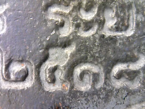 100× magnification — Luang Pu Tim amulet, Sema, 8th cycle (age 96), Nawa